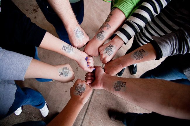 Smock employees with their fracking tattoos